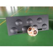 Dimpled rebound board tilted back, seen from above with a ball