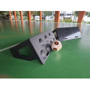 Dimpled and flat rebound boards on the court with a ball between them