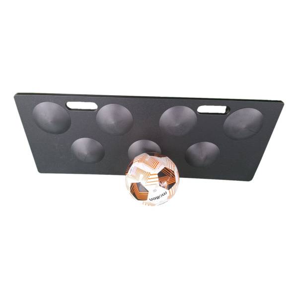 Dimpled rebound board with round dimples and two hand slots, a ball in front, on a white background