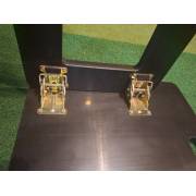 Two metal locking levers holding the folding legs open