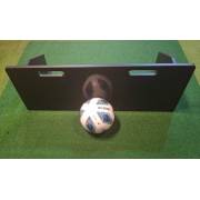 Flat black football rebound board standing on its folding legs with a ball in front