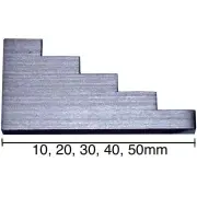 Grey 5 step calibration block with its steps marked 10, 20, 30, 40 and 50 mm