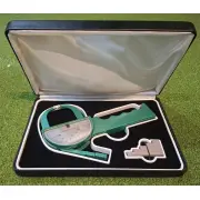 Green Lange skinfold caliper in its open case with the grey 5 step calibration block