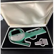 Second view of the caliper and calibration block in the open case